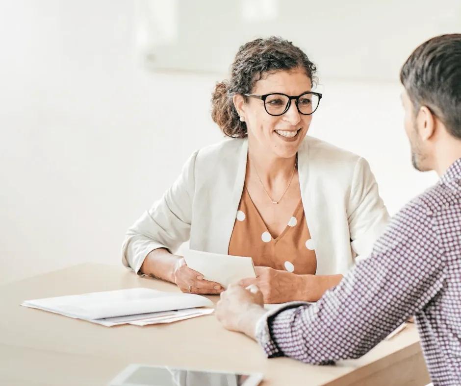Team huddle discussing aged care resident needs.