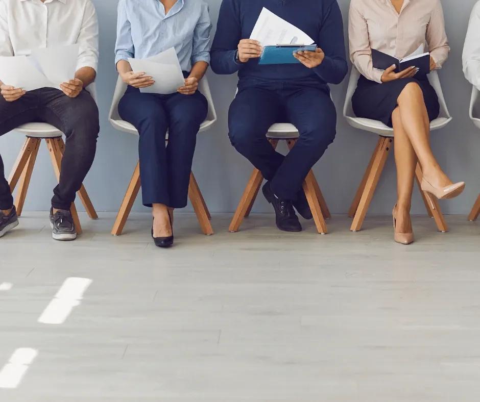 Job seeker reviewing research notes before drafting a cover letter.