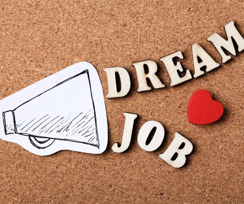 Manager coaching a team member while reviewing competency matrices.