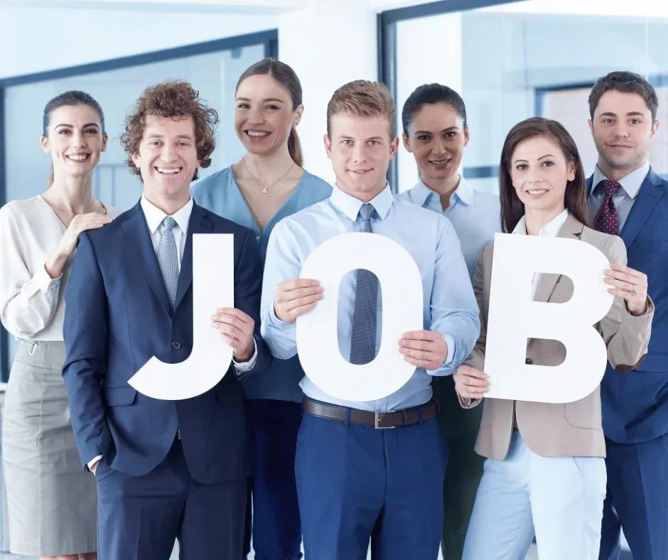 Australian professional drafting a cover letter with notes and charts nearby.