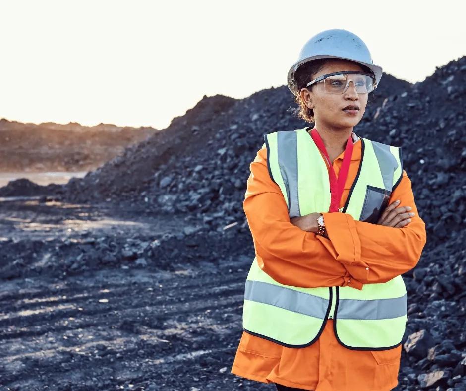 Professional reviewing a refreshed resume on a laptop.